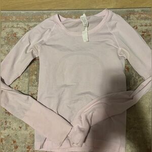 lulu lemon size 2 long sleeve pink strip shirt